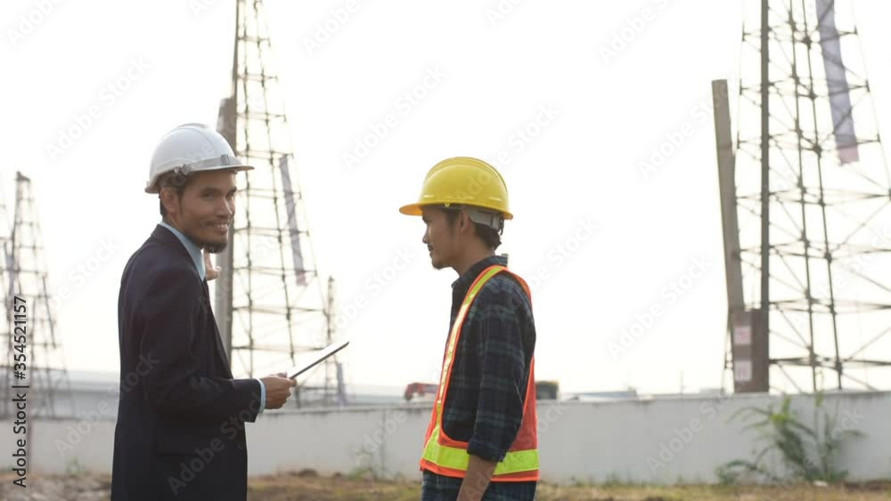 Engineering holding tablet work on road construction Engineering holding tablet work on road construction
