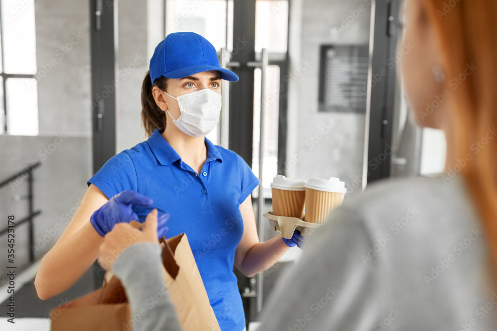 health protection, safety and pandemic concept - delivery woman in protective face mask and gloves giving paper bag with food and drinks to female customer at office health protection, safety and pandemic concept - delivery woman in protective face mask and gloves giving paper bag with food and drinks to female customer at office