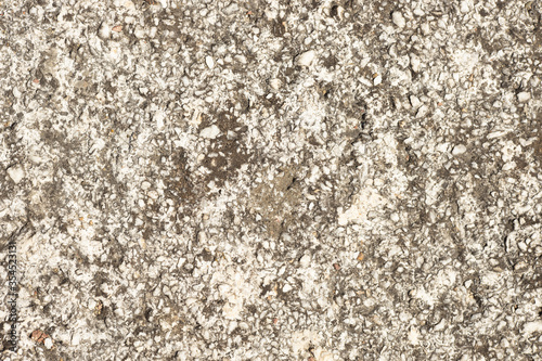 Close up of a lot of different sizes stones that are mixed with cement. The surface of wall  flooring texture and background for web design and architect.