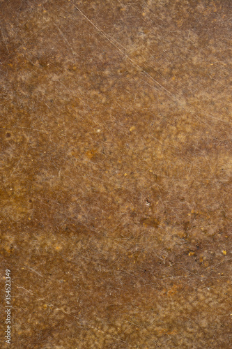 Seamless brown abstract dirty textured background of marble tile. Scratch lines over background. Noise and grain. Exterior building structure backdrop. Industry material natural concept.