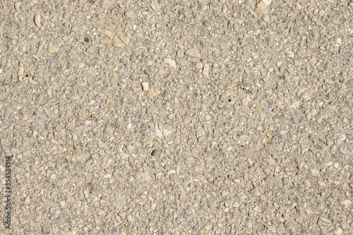 Close up of a lot of different sizes stones that are mixed with cement. The surface of wall, flooring texture and background for web design and architect.