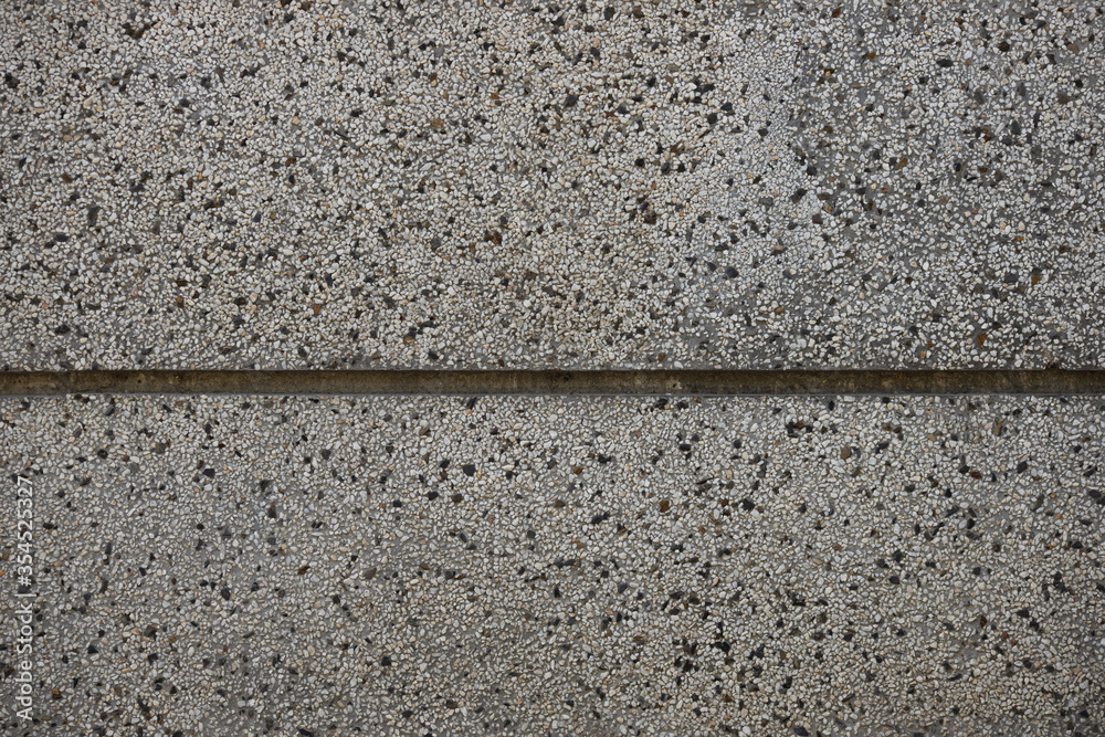 Close up a lot of small or tiny stones that are mixed with cement. The surface of concrete wall, flooring texture and background for web design and architect. Close up a lot of small or tiny stones that are mixed with cement. The surface of concrete wall, flooring texture and background for web design and architect.