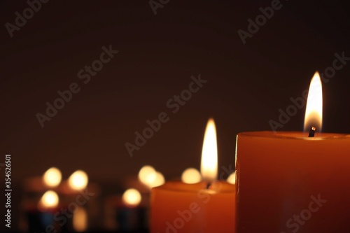 Candle black background of mourning funeral moment of silence