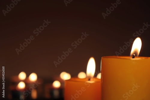 Candle black background of mourning funeral moment of silence