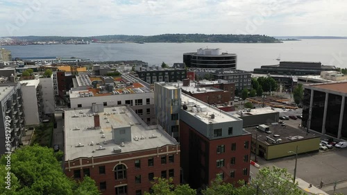 Aerial / drone footage of the Seattle waterfront, Belltown, Elliott Bay, Puget Sound streets without people downtown, in the commercial district of Seattle, Washington during the pandemic photo