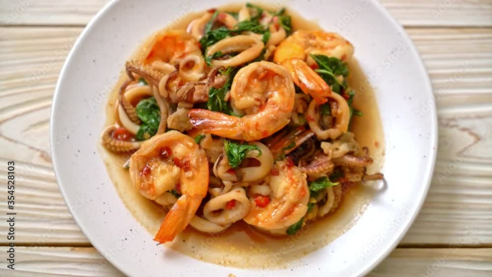 stir-fried seafood (shrimps and squid) with Thai basil - Asian food style