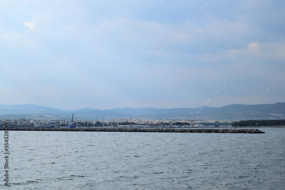 Cloudy seascape with Alexandroupolis harbour entrance