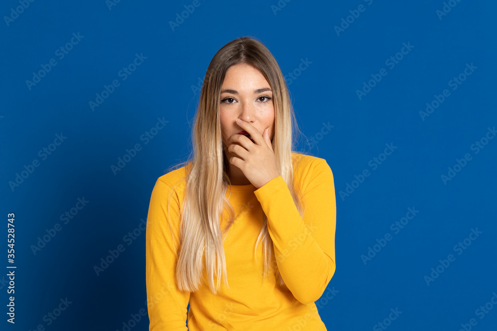Blonde girl wearing a yellow T-shirt Blonde girl wearing a yellow T-shirt