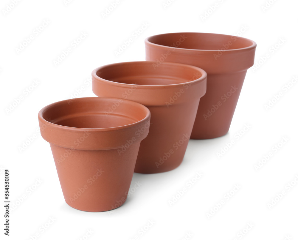 Stylish terracotta flower pots isolated on white Stylish terracotta flower pots isolated on white