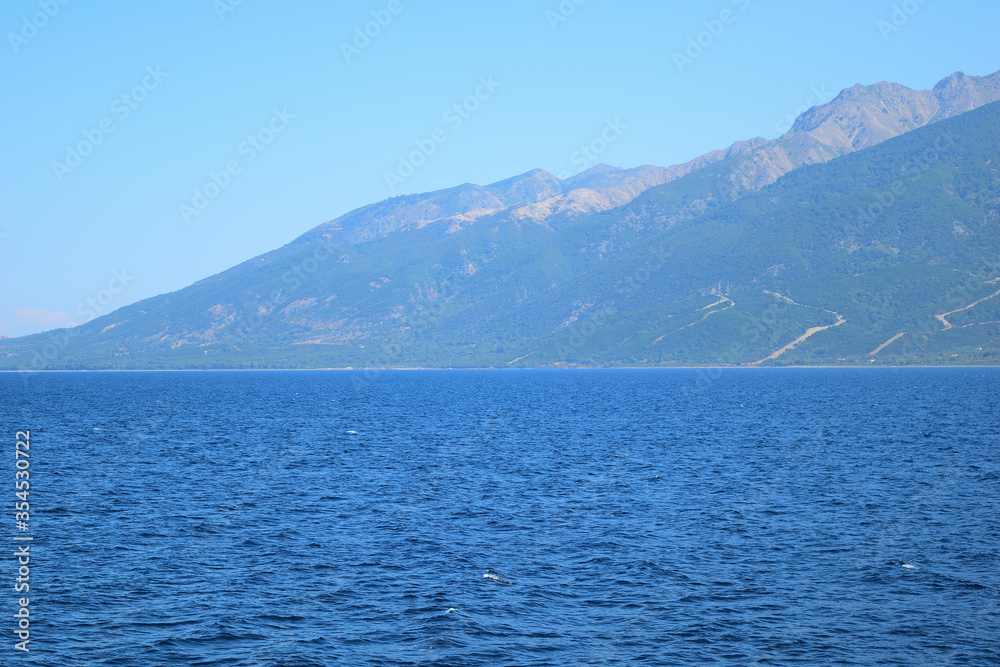 Seascape with Saos mountain and coastline Therma area - Samothraki island view from ferry - Greece, Aegean sea