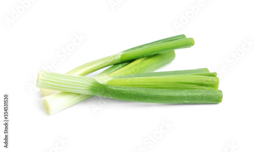 Fresh green spring onions isolated on white