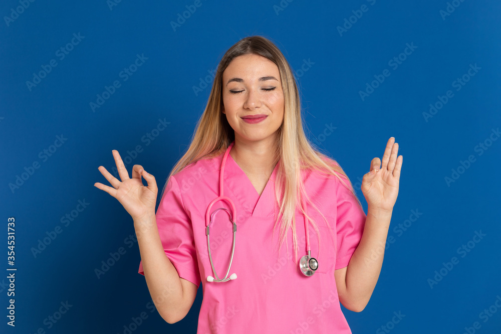 Blonde doctor with pink uniform Blonde doctor with pink uniform