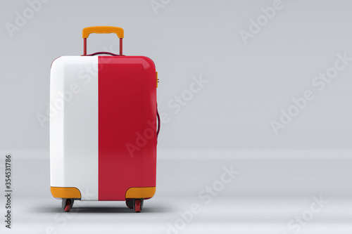 Monaco national flag on a stylish suitcases on color background. Space for text. International travel and tourism concept. 3D rendering.