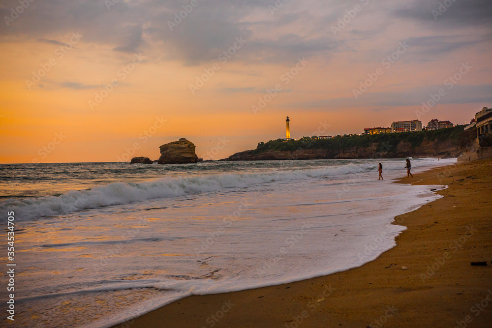 Breathtaking view of Biarritz Lighthouse (Faro de Biarritz) and the Atlantic ocean during sunset, Pays Basque, France