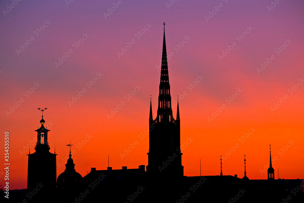Stockholm skyline at sunset, beautiful sunset over Stockholm Old town (Gamla  Stan), Spires against the sunset sky, Sweden. Picture with long exposure.
