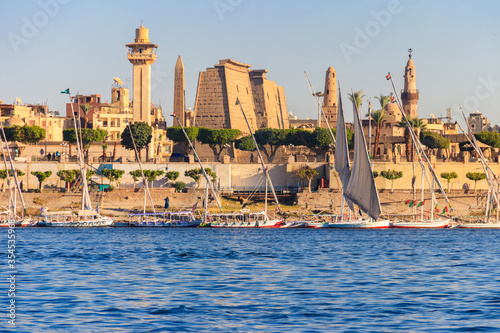 Luxor Temple is a large Ancient Egyptian temple complex on east bank of Nile river in Luxor (ancient Thebes). View from Nile river photo