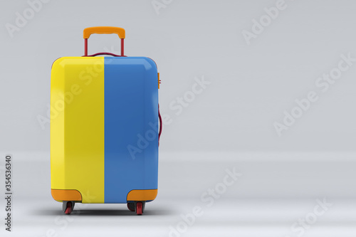 Ukraine national flag on a stylish suitcases on color background. Space for text. International travel and tourism concept. 3D rendering.