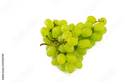Fresh grapes on a branch rest sits on a white background