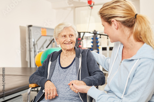 Physiotherapist takes care of senior woman