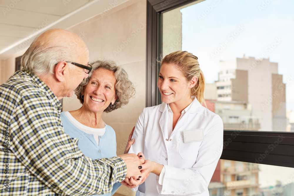 Seniors thank the doctor with a handshake Seniors thank the doctor with a handshake