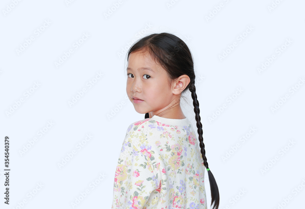 Cute asian little child girl looking camera from backside isolated on white background Cute asian little child girl looking camera from backside isolated on white background