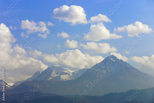 Summer mountain landscape. Mountain peaks and clouds. Zaili Alatau. Kazakhstan