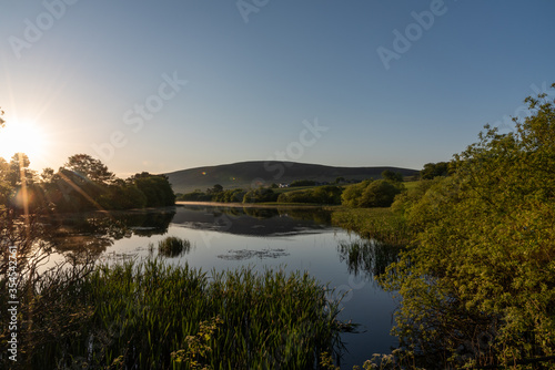 Sunrise over the lake in Pentland Hills