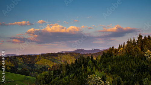 Germany  Colorful sunset sky and glowing red sky over endless black forest nature scenery of mountains in spring season