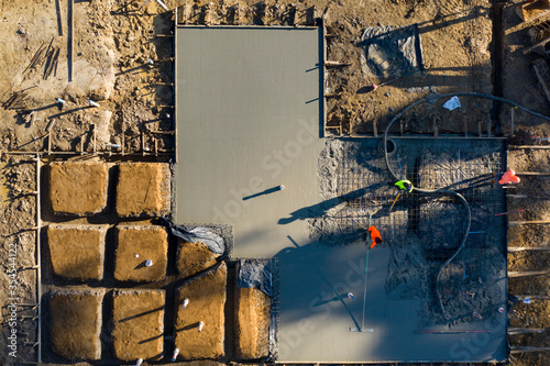Pouring and leveling a new concrete slab for a residential house under construction in Melbourne Australia