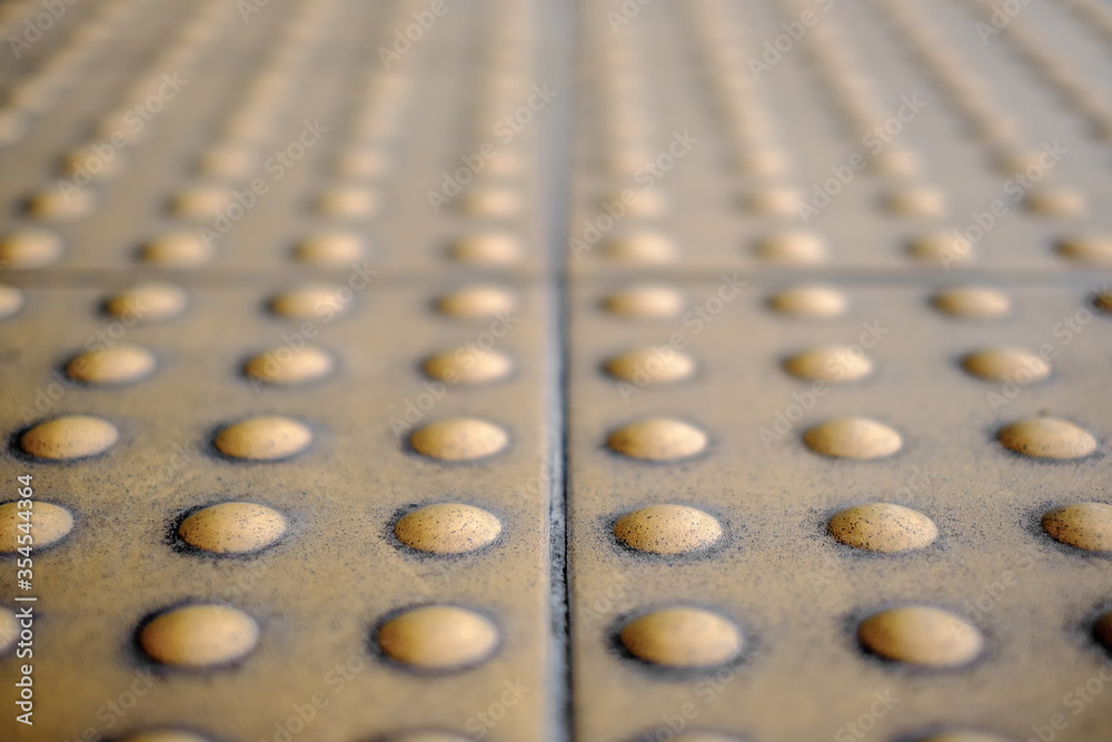 Yellow Braille Block , Dirty Braille Tile, Braille Block for Blinds Handicap, close up rough tactile Yellow Braille Block , Dirty Braille Tile, Braille Block for Blinds Handicap, close up rough tactile
