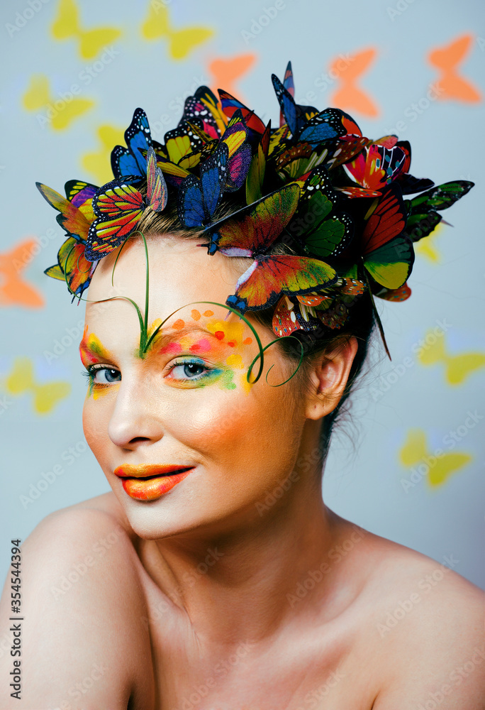 woman with summer creative make up like fairy butterfly closeup bright colored background woman with summer creative make up like fairy butterfly closeup bright colored background