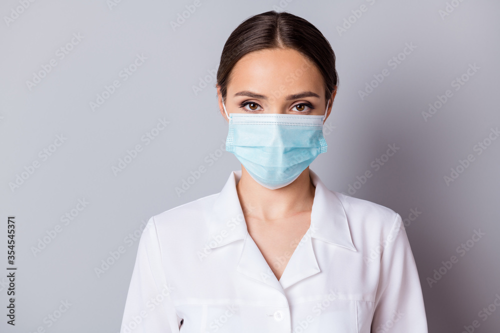 Closeup photo of attractive serious virologist doc lady experienced professional listen patient wear facial cotton mask medical uniform lab coat isolated grey background Closeup photo of attractive serious virologist doc lady experienced professional listen patient wear facial cotton mask medical uniform lab coat isolated grey background