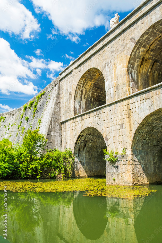 Croatia, beautiful 19 century stone bridge with arches in Tounj on Tounjcica river
