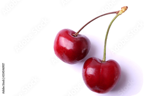 dark red cherries, close up shot, isolated on white