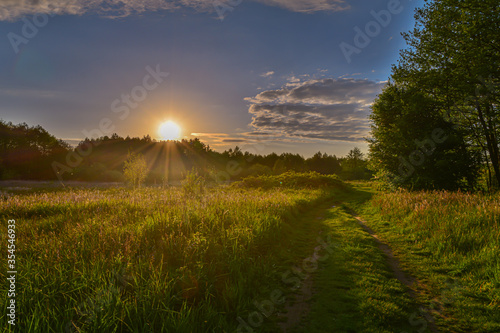 Grabia River surrounded by fields and forests in central Poland. photo