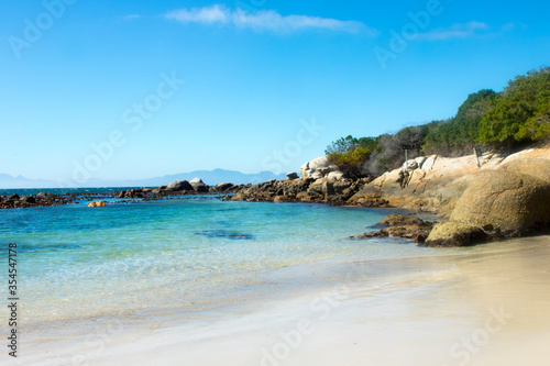 tropical beach with boulders