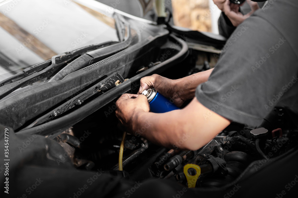 Car mechanic working on engine repair
