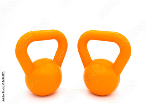 Orange kattlebell isolated on white with clipping path photo