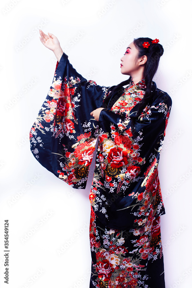 young pretty geisha in black kimono with sakura, asian ethno closeup on white background isolated young pretty geisha in black kimono with sakura, asian ethno closeup on white background isolated