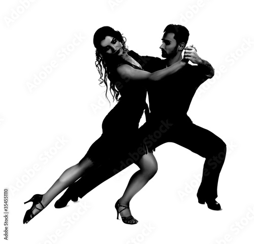 Passionate young couple dancing on white background