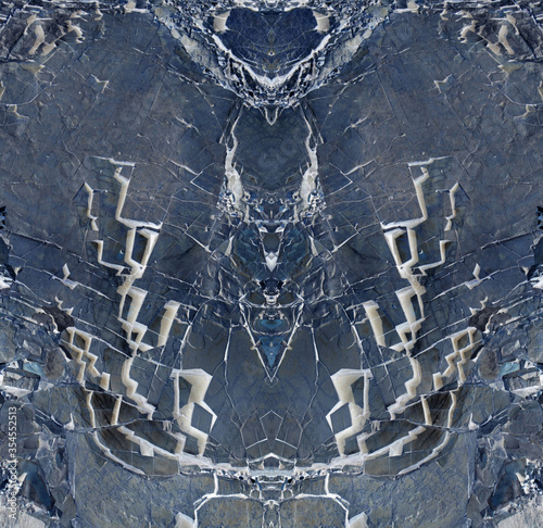 Abstract pattern of many cracks  in dark blue color. Picture is based on natural stone texture. photo