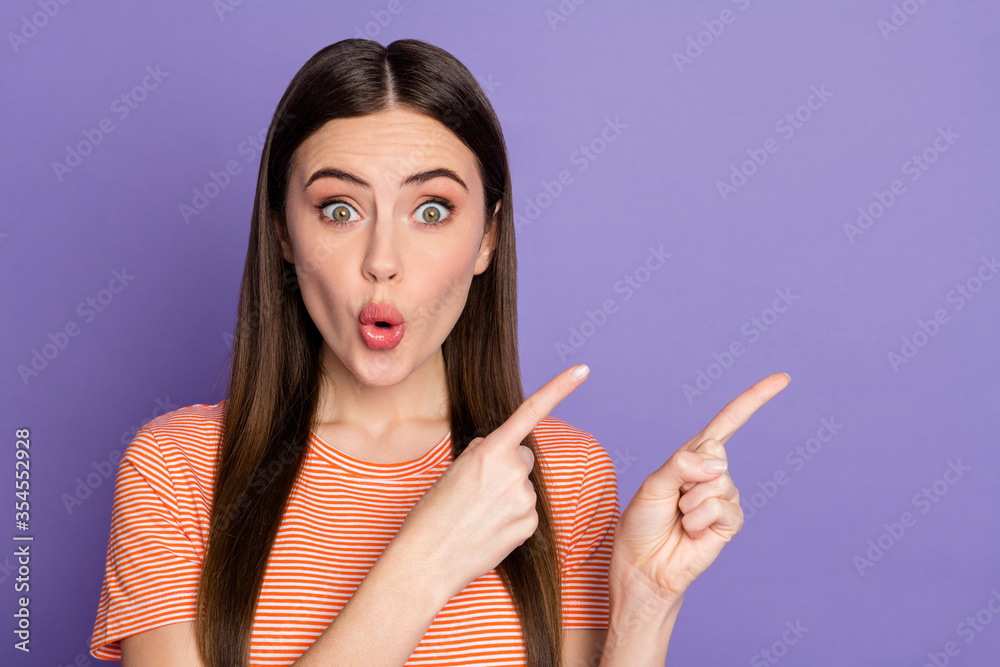 Obraz premium Closeup photo of attractive open mouth lady direct fingers new sale product low price not believe eyes wear casual orange striped t-shirt isolated pastel purple color background