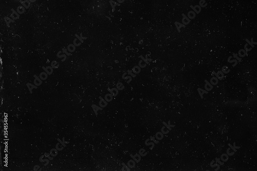 Film grain texture. Black grunge background