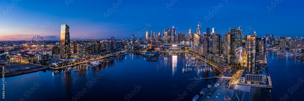 Naklejka premium Aerial view of Melbourne's docklands precinct with the CBD in the background