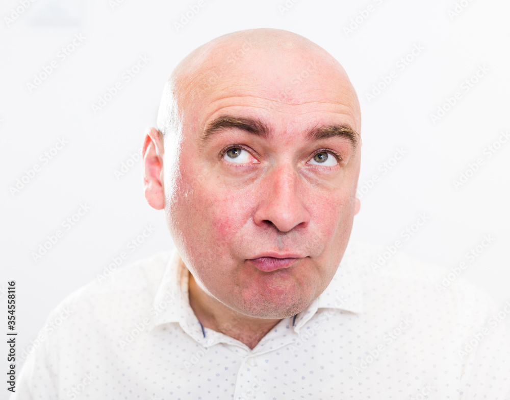 portrait of bald adult mature man with emotions on white background portrait of bald adult mature man with emotions on white background