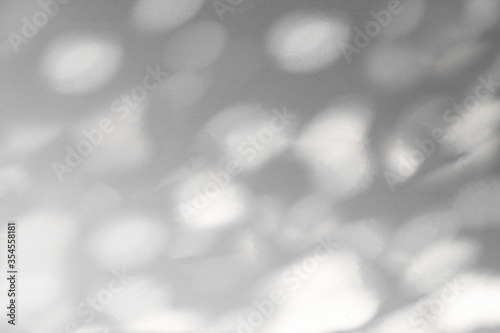Abstract leaves shadow background with light bokeh