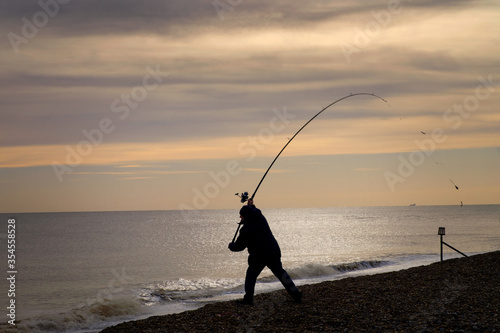 Schilderij op canvas Silhouette of man fishing on Aldeburgh Beach, Aldeburgh, Suffolk