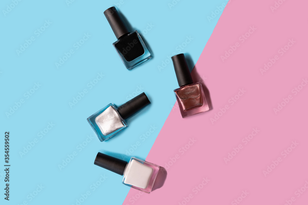 Bottles with nail polish on colorful background Bottles with nail polish on colorful background