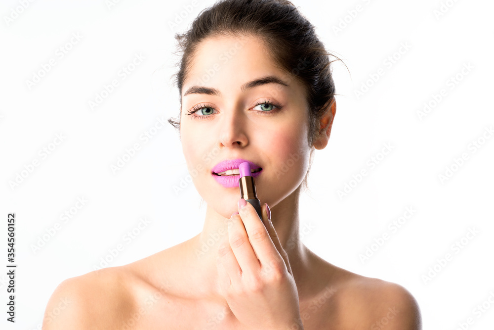 Beauty shot of beautiful woman applying lipstick Beauty shot of beautiful woman applying lipstick