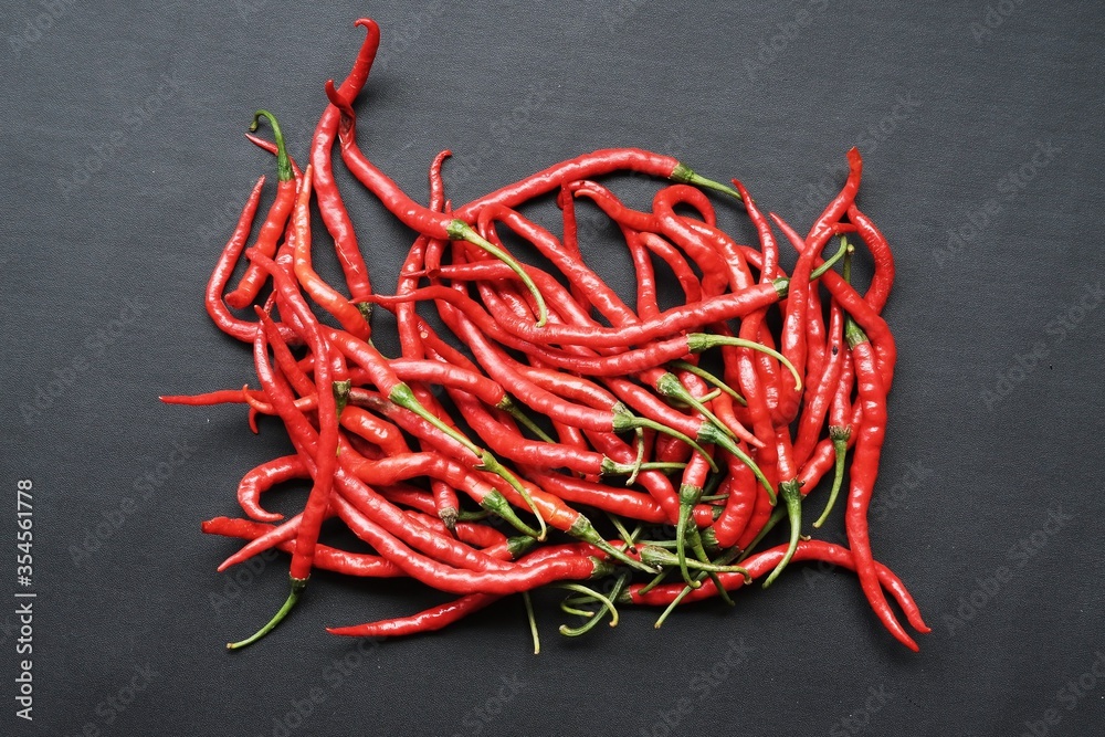 curly chili pepper on black isolated background curly chili pepper on black isolated background